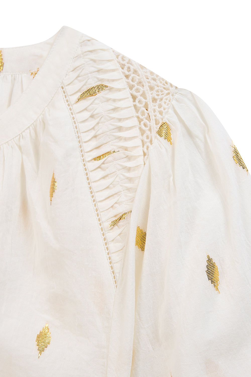 White women’s cotton blouse with gold embroidery and lace inserts.
